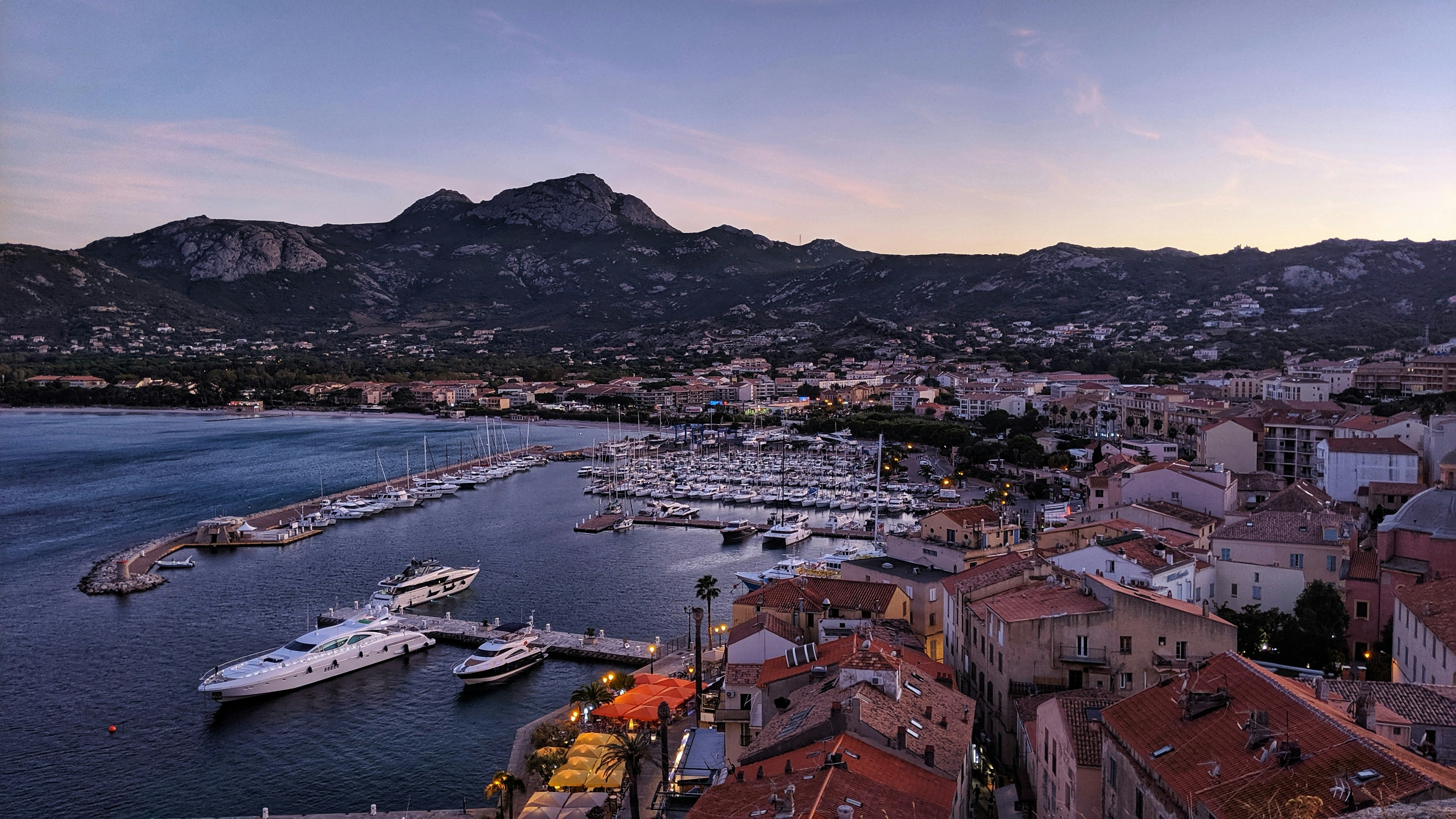 fading light over the harbour in calvi corsica calvi france