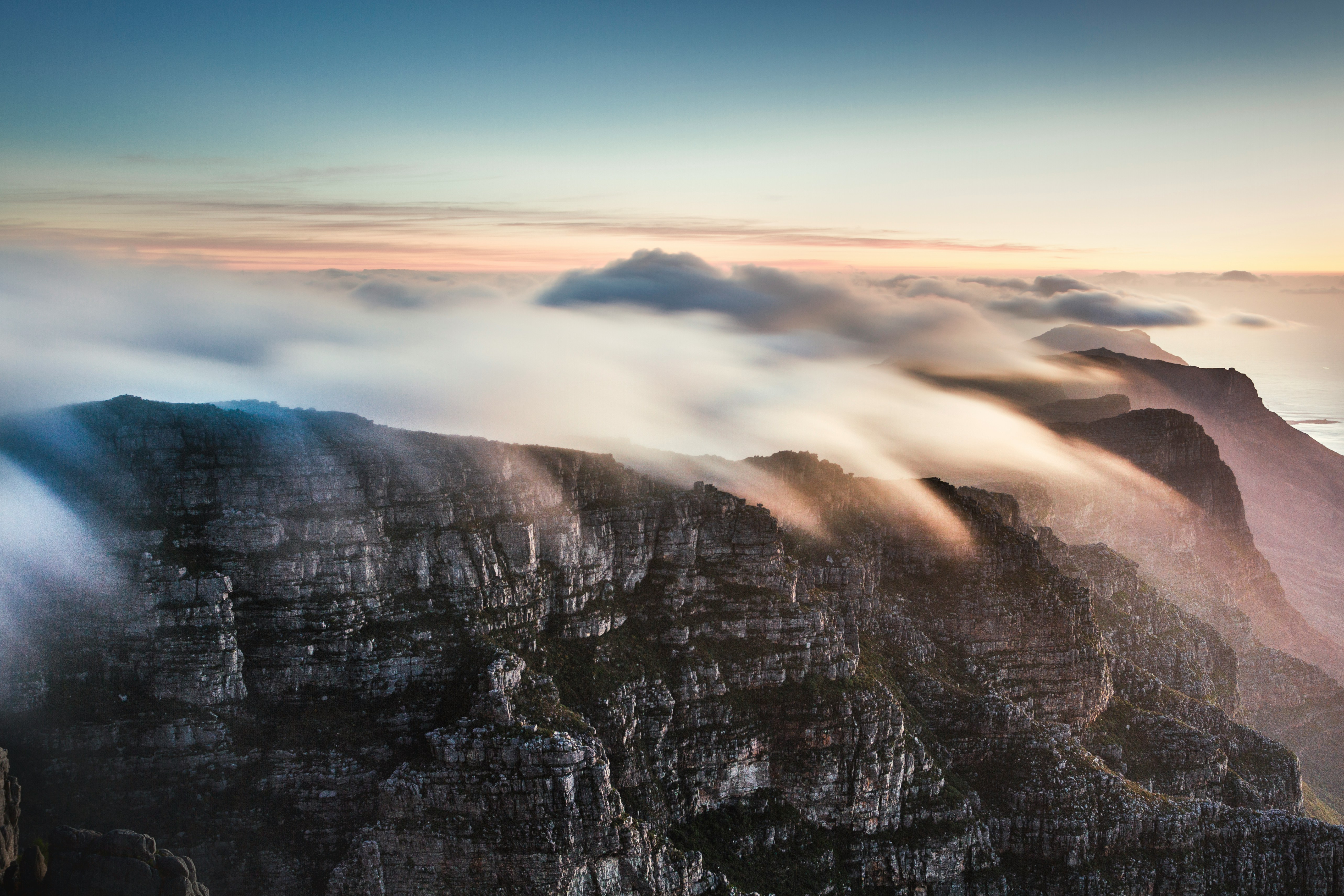 cable car up to the top of table mountain to enjoy the sunset twelve apostles